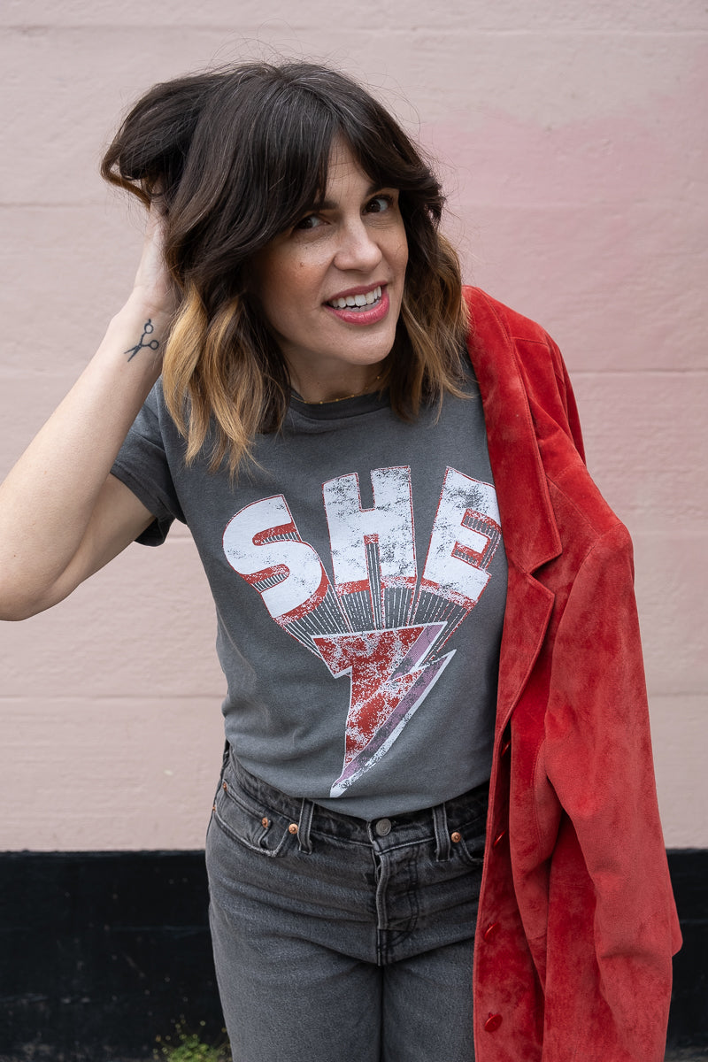 the "she energy" graphic tee on vintage black