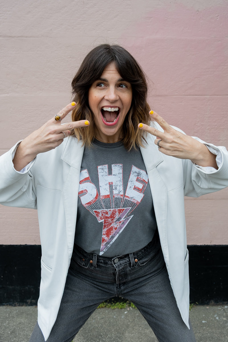 the "she energy" graphic tee on vintage black