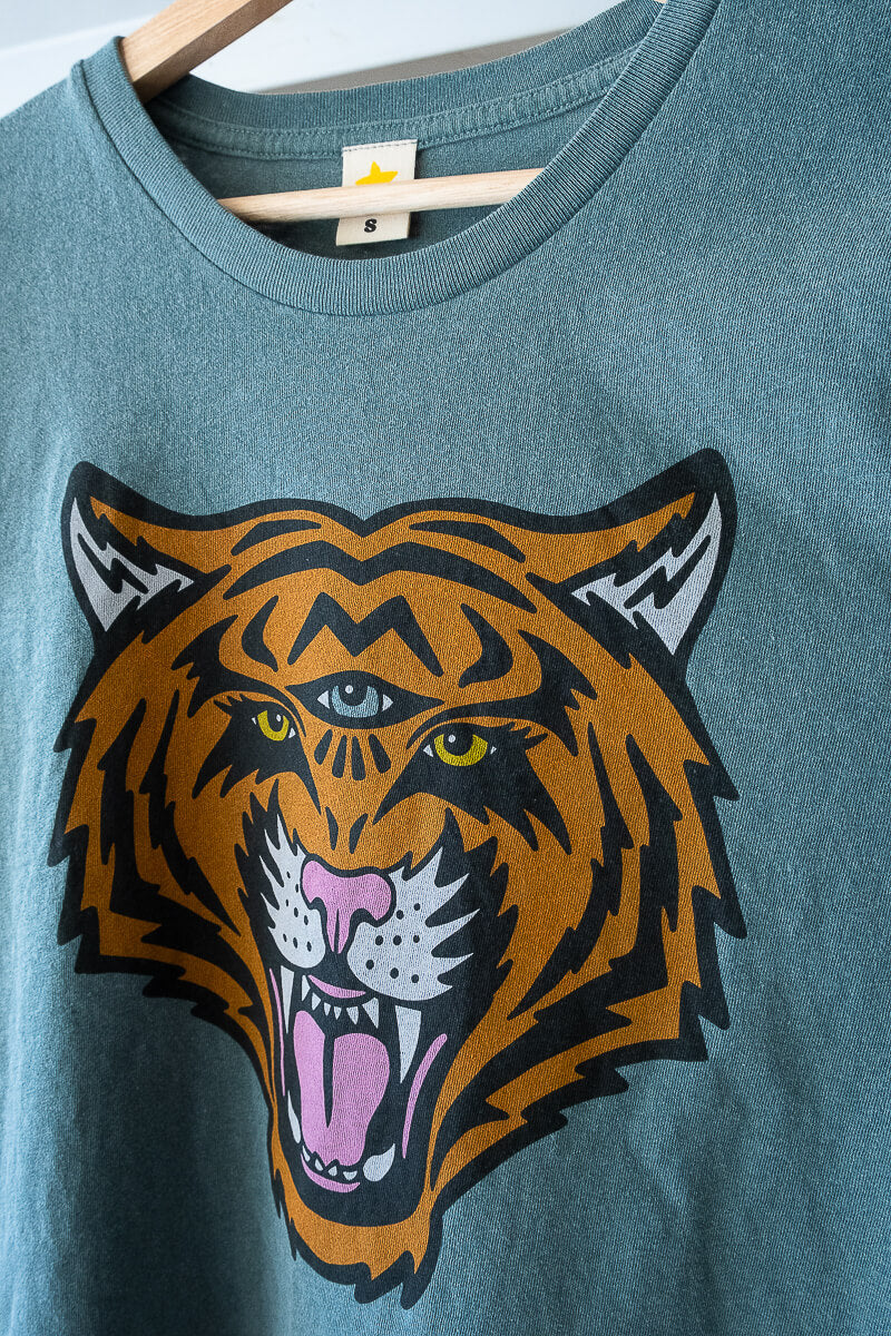 the "cosmic tiger" graphic tee on vintage green