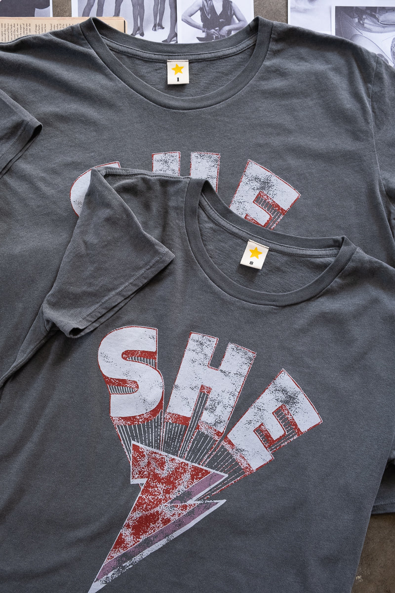 the "she energy" graphic tee on vintage black
