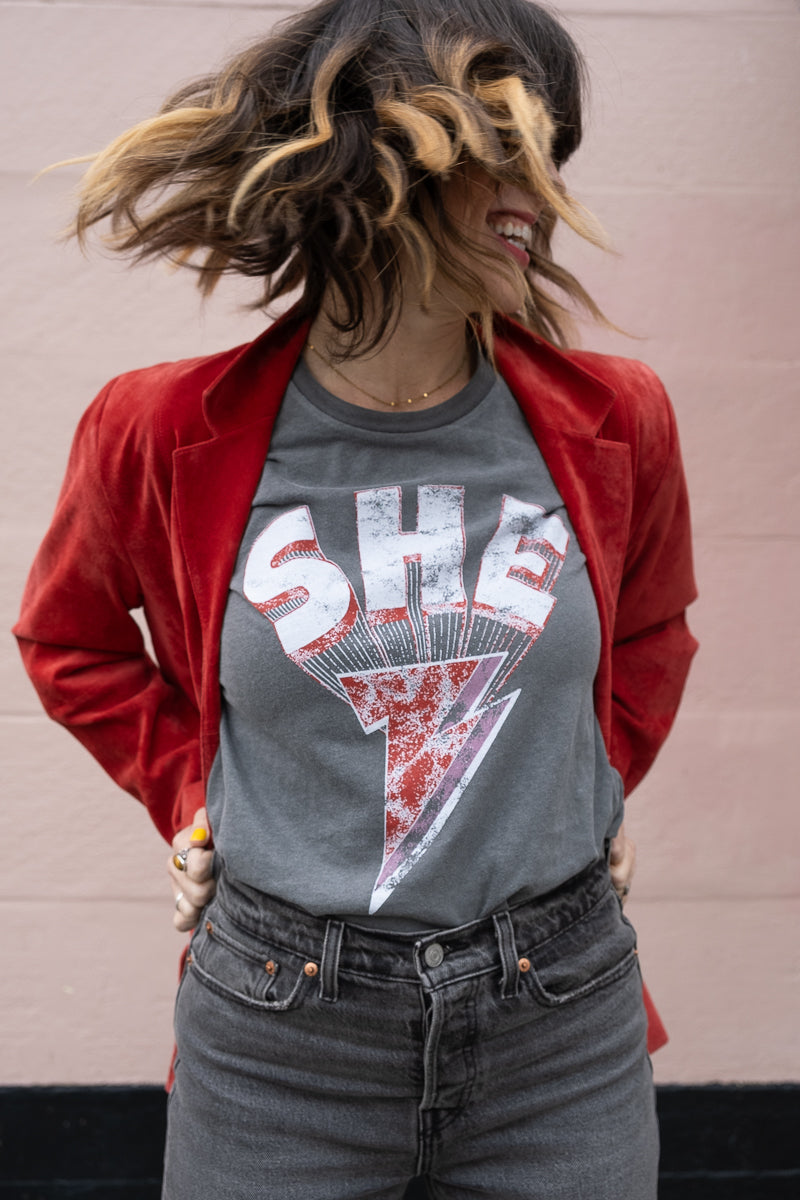 the "she energy" graphic tee on vintage black
