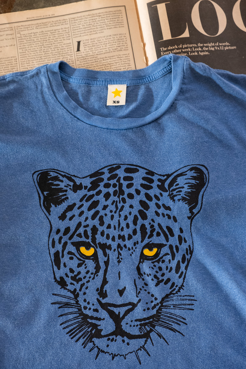 the "snow leopard" graphic tee on blue