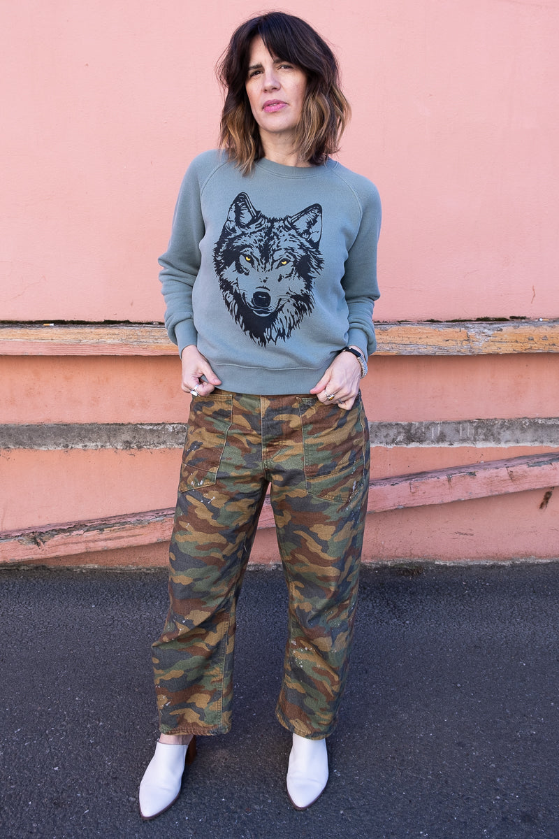 the "mother wolf" vintage wash sweatshirt on green